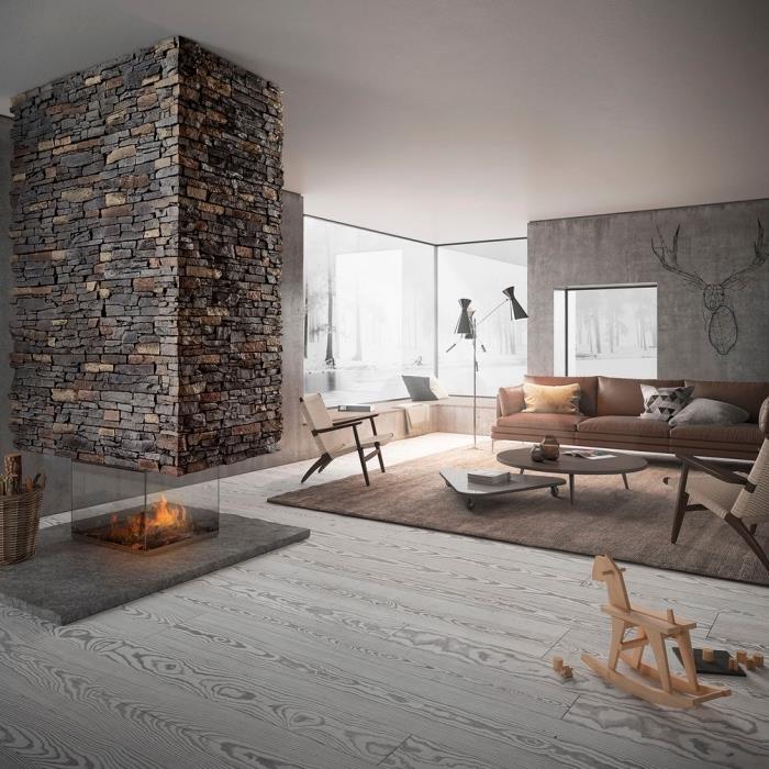 Nápad na usporiadanie obývačky s kamennou stenou, sivým a dreveným interiérovým dizajnom obývačky s farbou s efektom voskovaného betónu