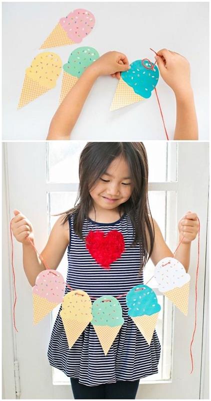 مخاريط الآيس كريم الورقية ، ألعاب جماعية داخلية للأطفال ، فتاة تمسكها ، على قطعة من حبلا