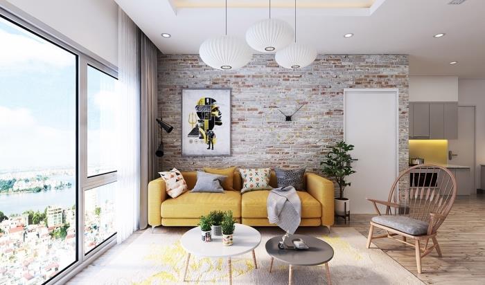 príklad horčicovožltého dekora v otvorenej obývačke s bielymi stenami, model konferenčného stolíka v bielej farbe a dreve