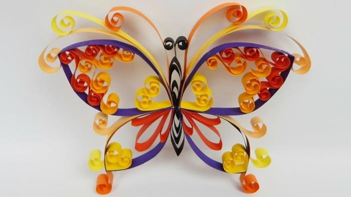 originálne skladanie papiera, viacfarebný motýľ vo farbách dúhy