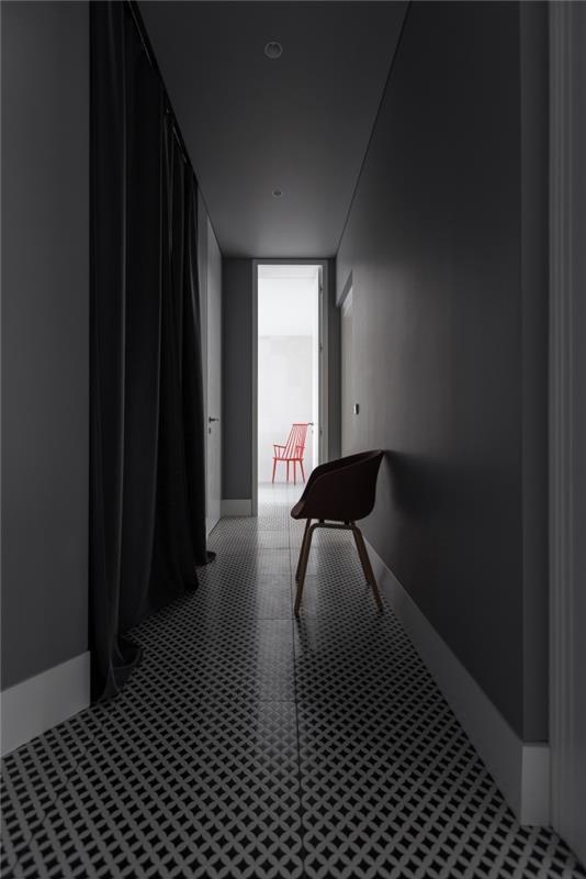 nykter och sofistikerad lång och smal korridordekoration med svartvitt grafiskt vinylgolv med utsikt över ett vitt vardagsrum