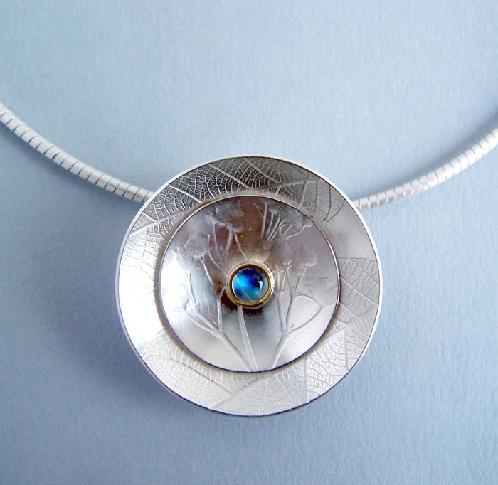 moonstone-pendant-set-in-the-middle-of-a-metal-element