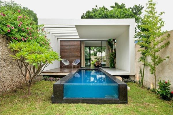 litet-över-mark-pool-design-av-samtida-hus