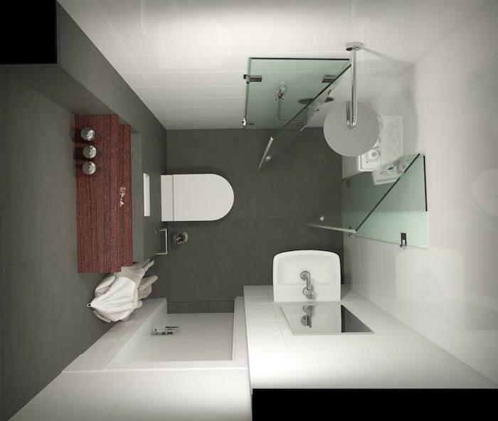 malá štvorcová kúpeľňa s otvoreným sprchovacím kútom v rohu na antracitovo šedej dlažbe