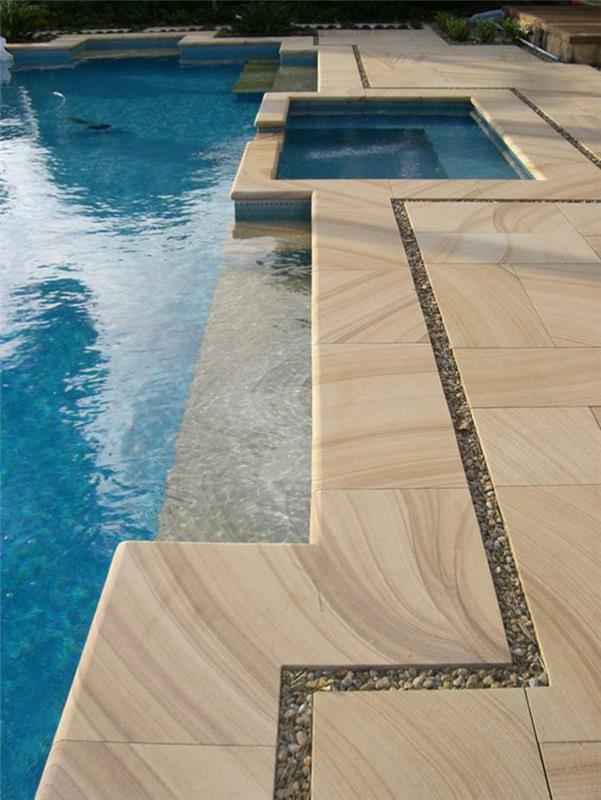 stenbassäng med sandeffekt, geometrisk pool med eleganta linjer