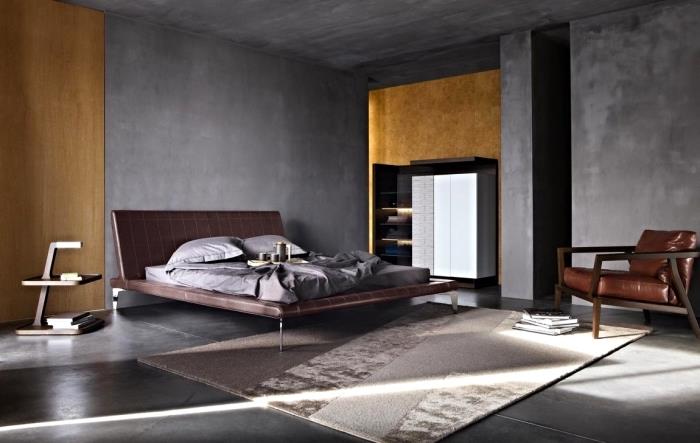 nápad, ako vyzdobiť mužskú spálňu betónovými textúrami, veľký model postele s hnedým koženým čelom