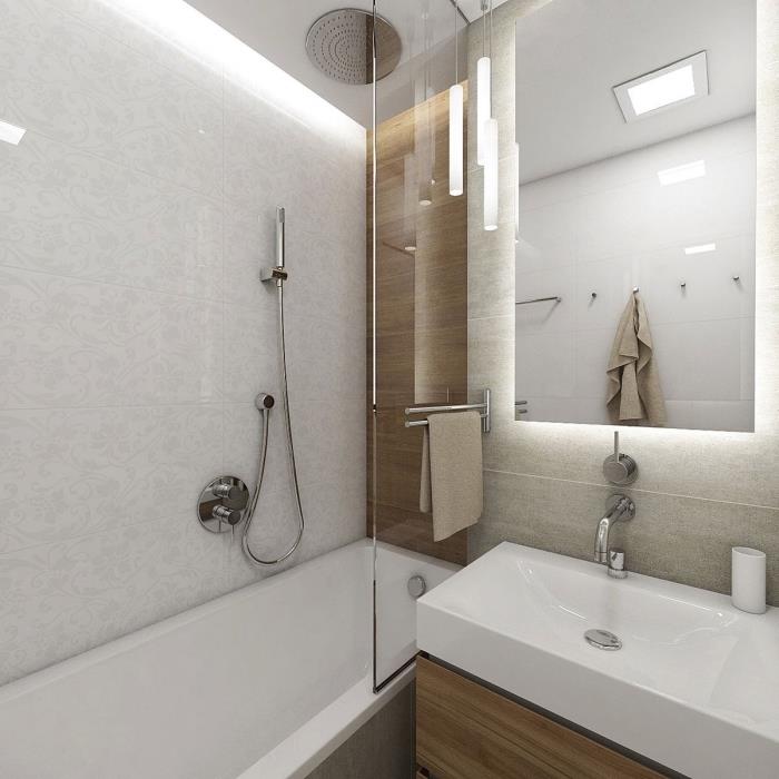 snygg inredning i ett litet badrum inrett i neutrala färger med silvermetallfärger