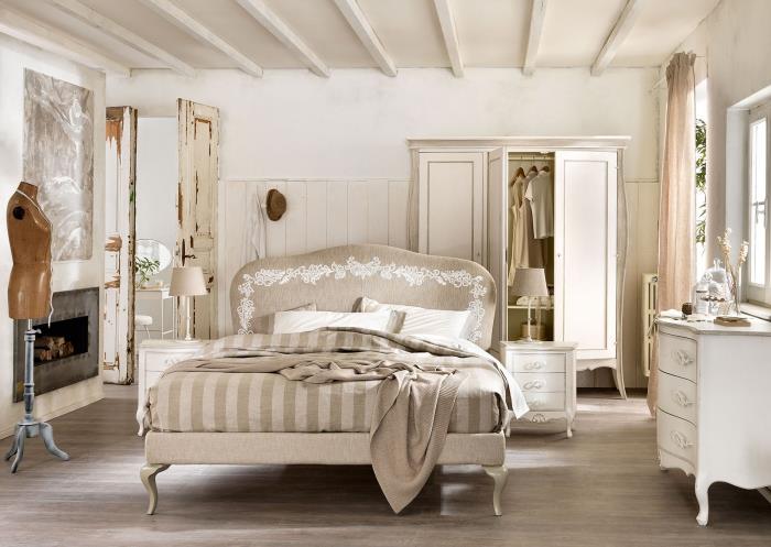 vuxen sovrum med vita väggar med ommålade shabby chic stil möbler och betong öppen spis