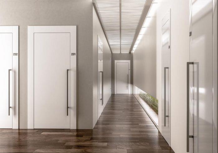 dörrar för offentliga byggnader vita dörrar stor korridor