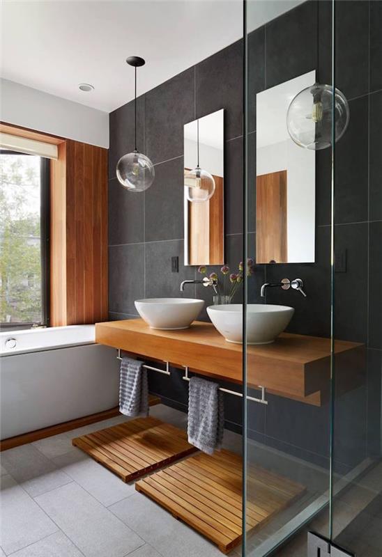 kúpeľňa s kombináciou antracitovo šedej a béžovej, tmavosivej dlažby do kúpeľne, nábytku z exotického dreva do zenovej kúpeľne