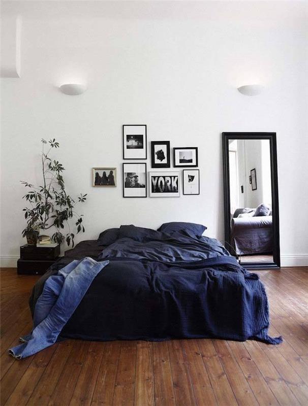 Skandinavisk sänggavelmodell i fotoramar och svartvitt ritning, blå sänglinne, brun parkett