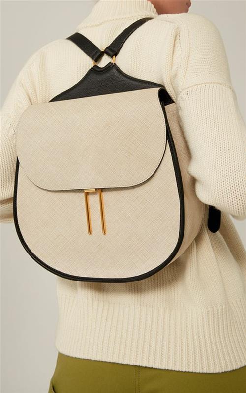 minimalistisk svart och beige läderryggsäck i form av en hästsko