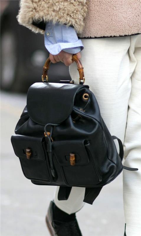 trendig damryggsäck med bambuhandtag en Gucci -skapelse i svart chic casual stil