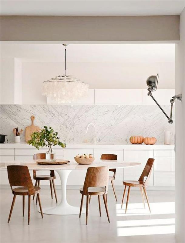 Skandinavisk-matsal-vit-oval-bord-stolar-kök i skandinavisk stil
