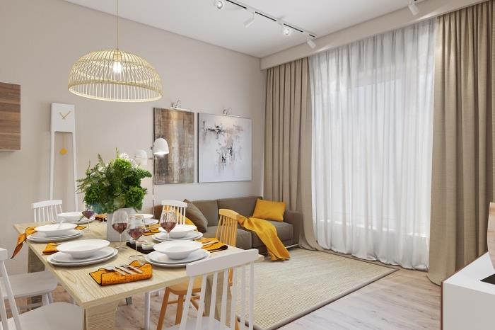 nápad, ako zariadiť obývaciu izbu s jedálenským kútom, moderný interiérový dizajn v béžových a drevených farbách s predmetmi zafarbenými horčicou