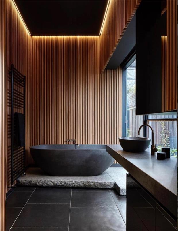 Idea kúpeľne v štýle deco relax, dizajn kúpeľne s drevenými stenami s antracitovo sivou podlahou, tmavosivý model vane