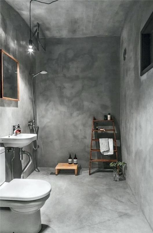 حمام مع تغطية كاملة بأرضية خرسانية مشمعة من الأسمنت الرمادي والحائط والسقف مع دش إيطالي بدون بلاط