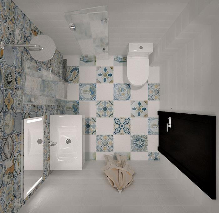 malý úložný priestor v kúpeľni s bielymi dlaždicami a mozaikovými dlaždicami v orientálnom portugalskom štýle, s wc a bielym umývadlom