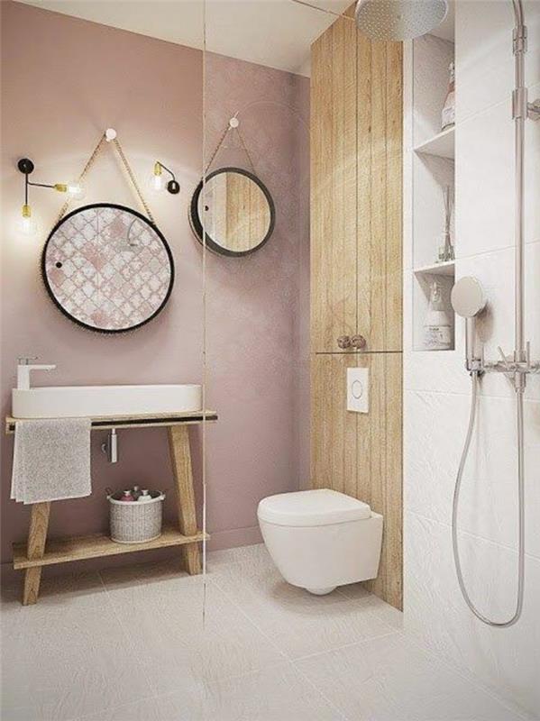 svetlo-ružová-kúpeľňa-okrúhla-zrkadlo-podlaha-v-béžovej farbe-dlažba-dizajn-stena-v-ružovom-svetle