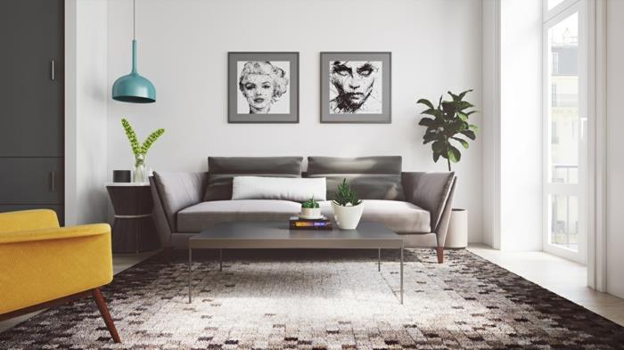 Škandinávske usporiadanie obývačky, sivá sedačka a konferenčný stolík, čierny, biely a sivý škandinávsky koberec, horčicovo žlté kreslo, grafické návrhy dekorácie na stenu