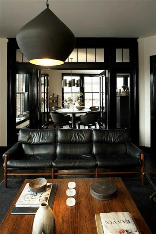 obývačka-koža0čierna sedačka-drevený stôl-čierny luster-obývačka-čierny-koberec-stôl