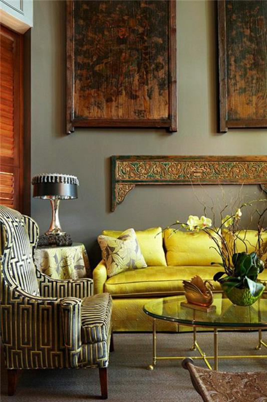 luxusná obývačka-v-žltej koži-kvety-sklenené-stolíky-železo-nástenka-maľba-parkety-podlaha