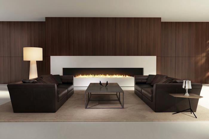 brun bistre design vardagsrum med bruna skinnsoffor och stor modern öppen spis
