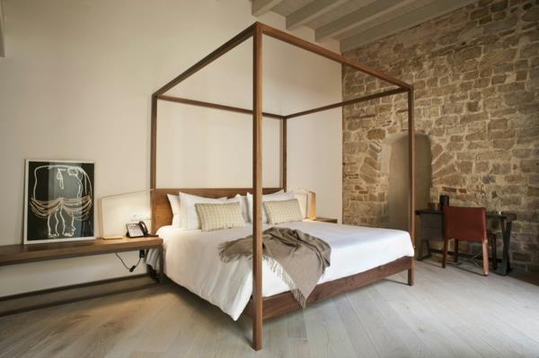 enkel design-imponerande-interiör-sten-rum-sovrum-säng-sten-på-väggen