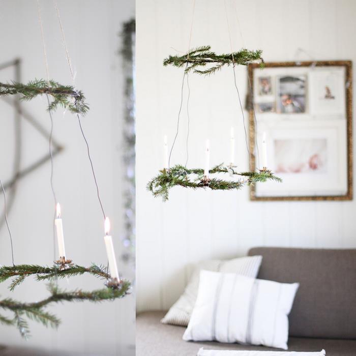škandinávske vianočné mobilné deko, zavesenie na borovicovú vetvu a biele sviečky, severská sivá a biela výzdoba obývačky