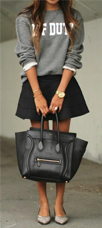 grå-tröja-kvinna-svart-flared-kjol-svart-läder-väska