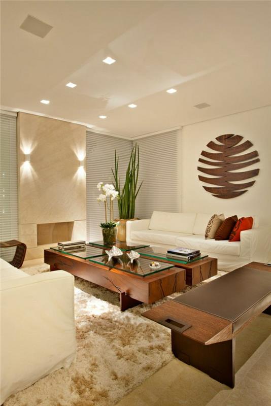 konferenčný stolík-moderný-obývačka-béžový-koberec-zelené-rastliny-biela-sedačka-kvety-v-obývačke