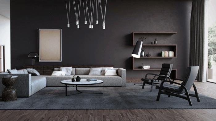 modern inredningsidé i ett stort vardagsrum med kolgrå väggar möblerade med svarta och ljusgrå möbler