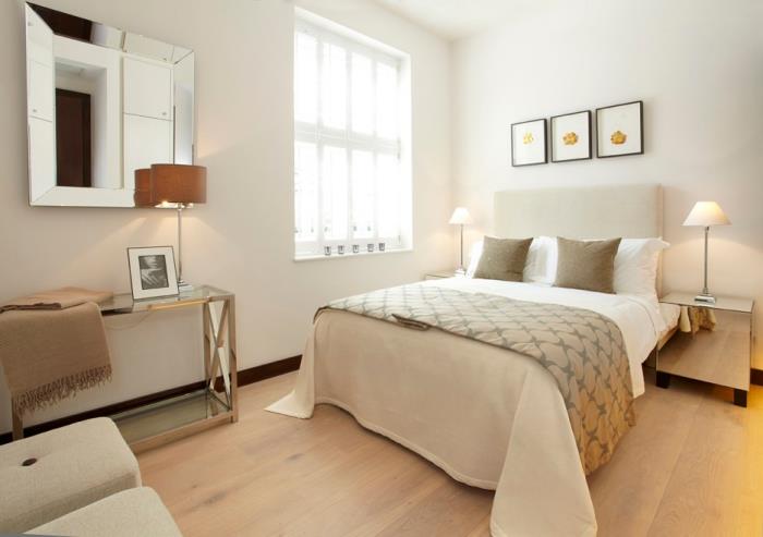 minimalism och stil i det vuxna sovrummet med beige säng och moderna metalliska möbler