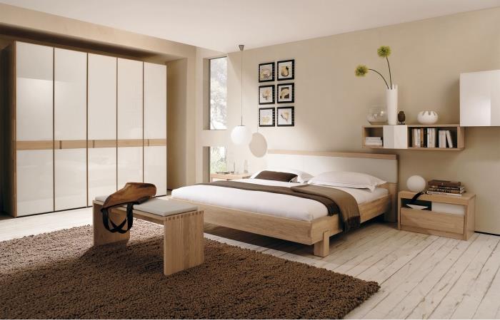 designer sovrum inrett i neutrala färger och ljusa trämöbler, vit och trä garderob modell