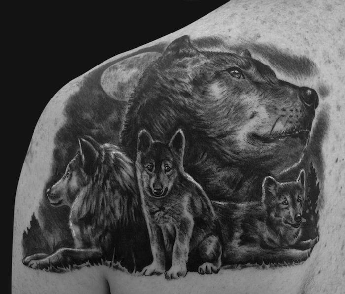 význam tetovania vlka, symbolická kresba tušom s rodinou vlkov a splnu