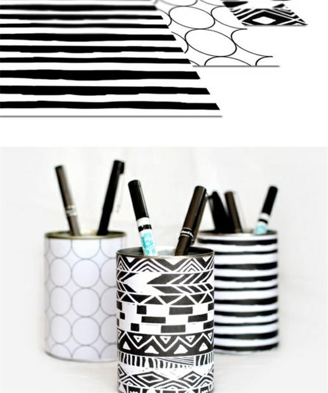 plåtburkprojekt, tre ark svartvitt mönstrat papper, lindade runt tre plåtburkar som innehåller olika pennor