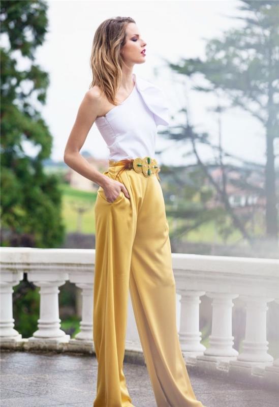 ako zladiť farby jej šiat, model nohavíc so širokými nohavicami so zlatým pásom zdobeným zelenými kamienkami
