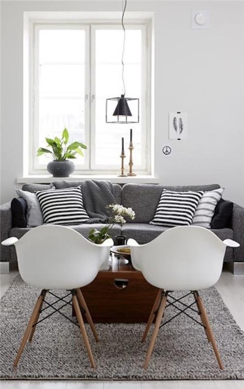 ett-vackert-vardagsrum-färgat-grå-vita-stolar-i-vardagsrummet-grå-möbler-och-grå-matta-saint-maclou-
