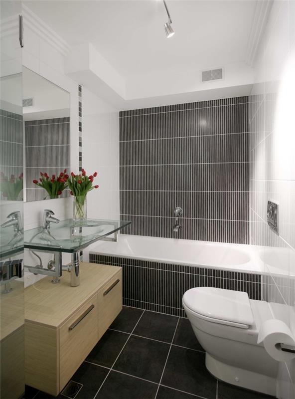 3m2 badrumsmodell med vita väggar med mörka golvplattor, exempelvis handfat i glas med underskåp i ljust trä