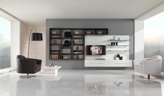 bokhylla i trä, fina vardagsrum, svartvitt, fåtöljer i läder, vitt klinkergolv, minimalistisk design